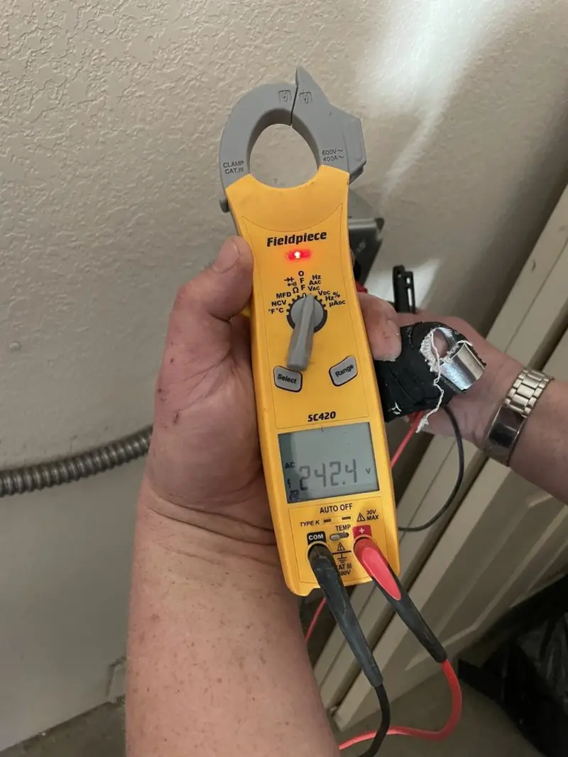 Voltage testing with clamp meter during Generator Installation in Deerfield